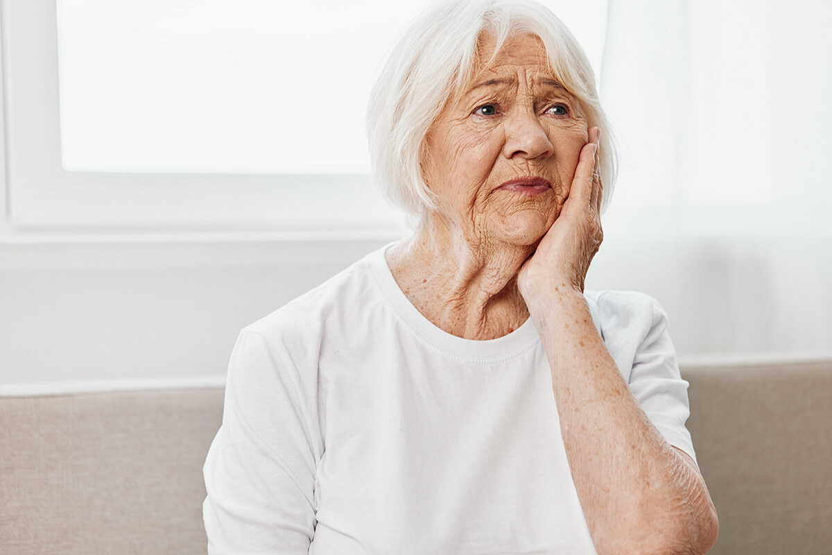 Elderly woman severe tooth pain